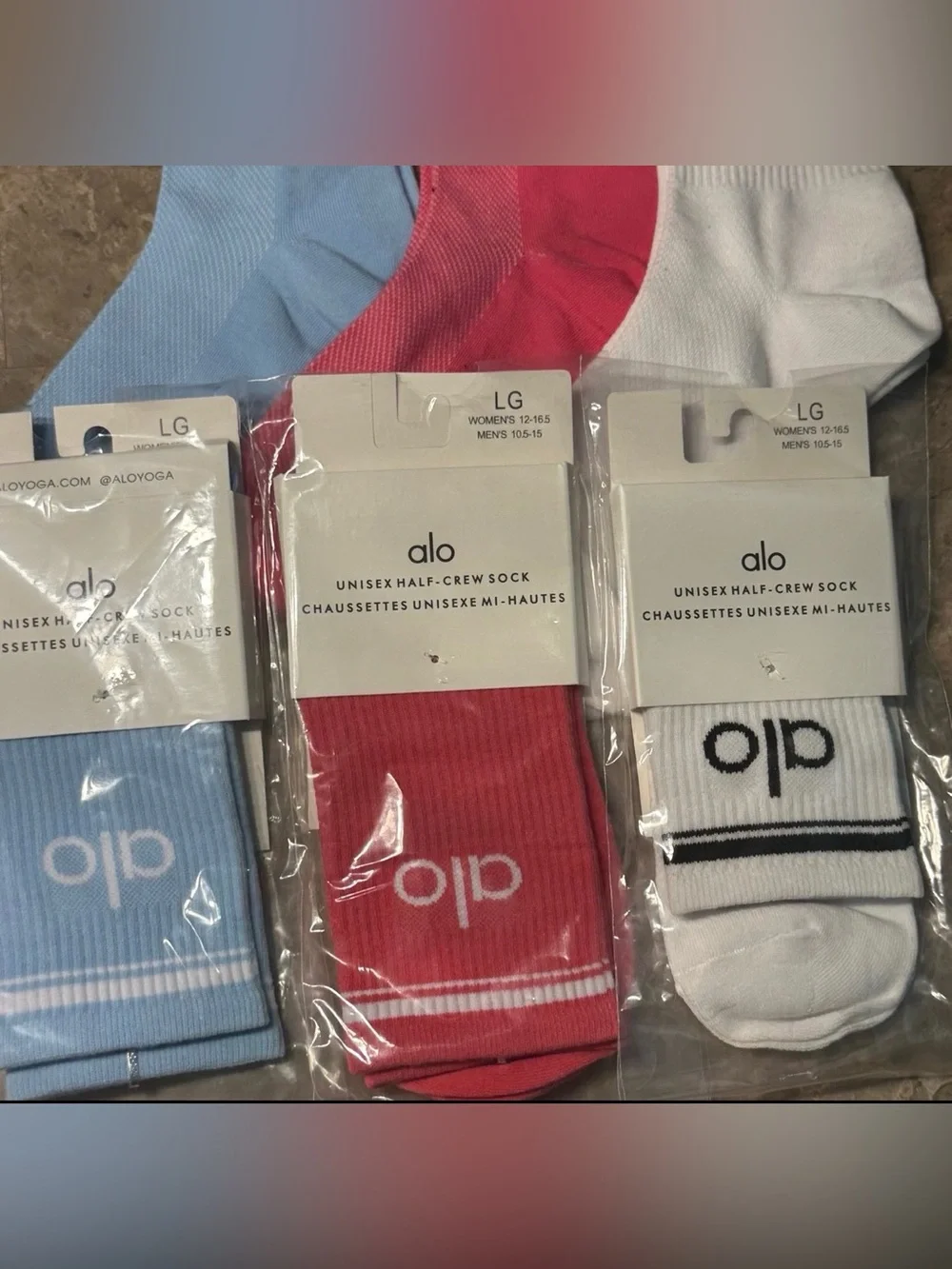 Women’s Alo Socks 3 pairs Packaging states size Large but they fit sizes 6-11